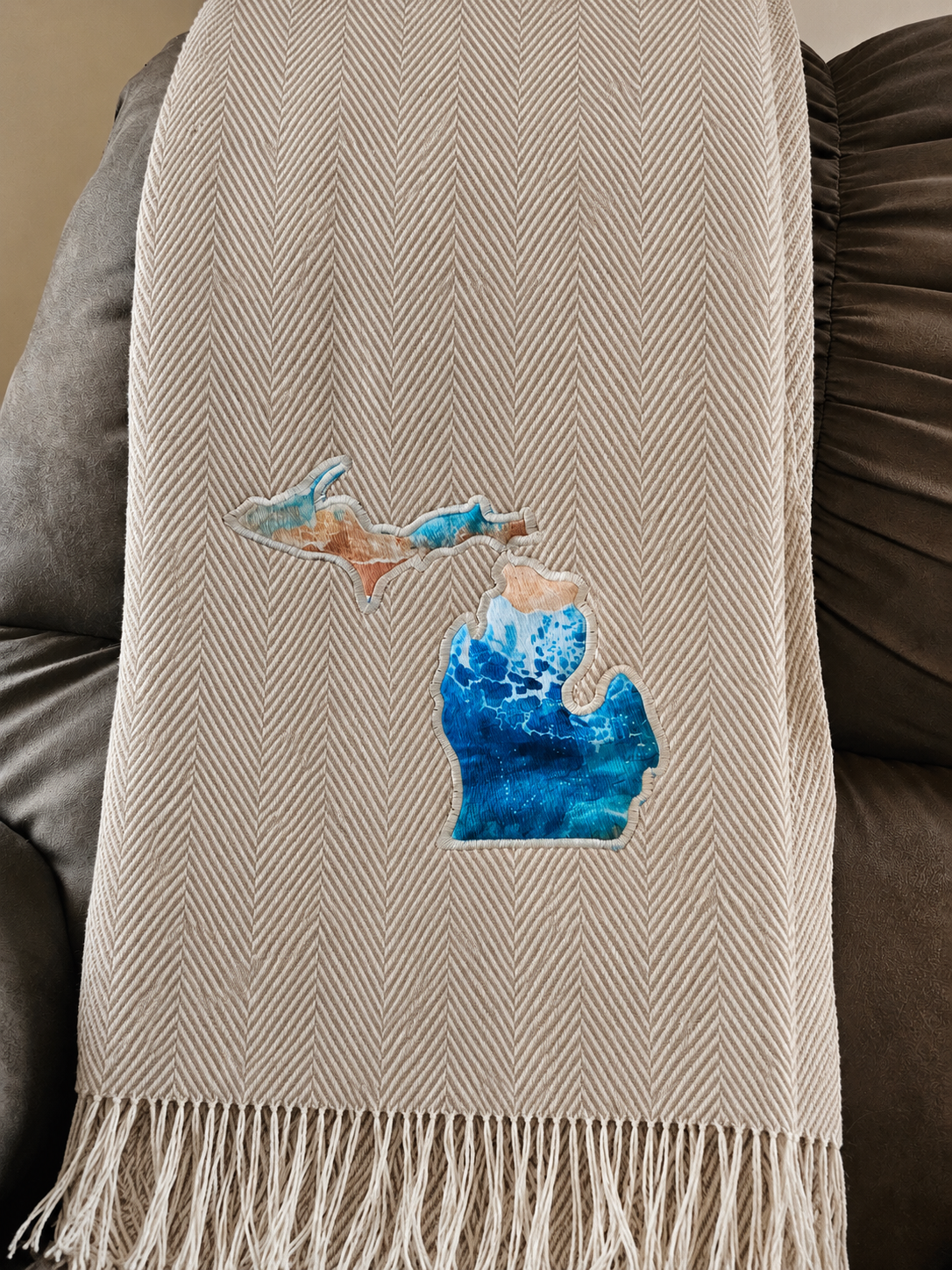 CloudSoft acrylic herringbone throw, driftwood lakeshore, with crisp geometric herringbone and fringe.