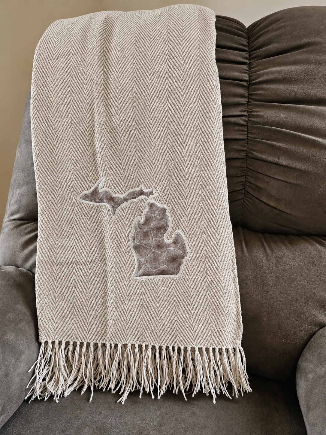 CloudSoft acrylic herringbone throw, driftwood toskey, with crisp geometric herringbone and fringe.