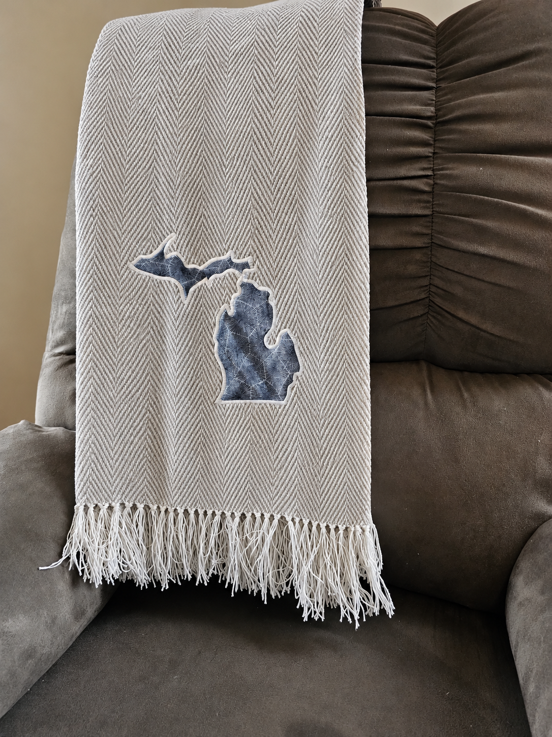 CloudSoft acrylic herringbone throw, stone toskey, with crisp geometric herringbone and fringe.